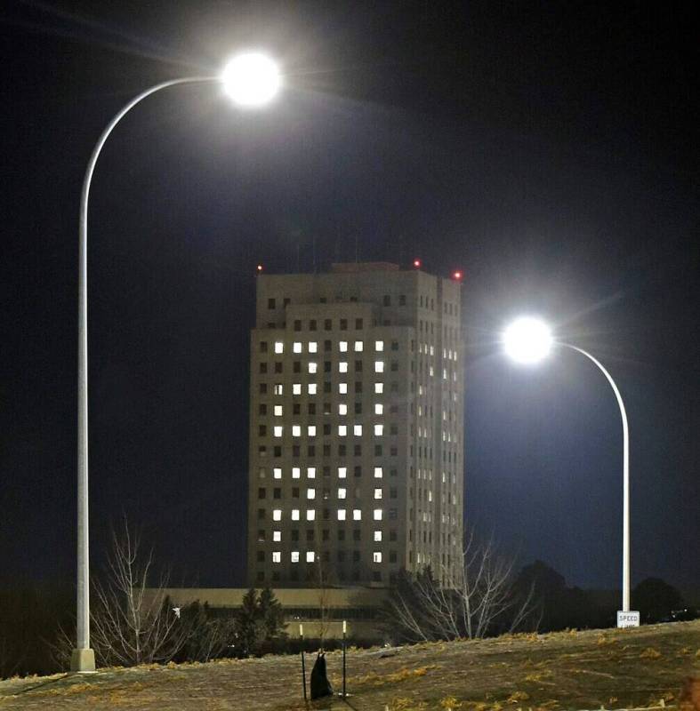The year 2024 is shown in the windows of the State Capitol building during a New Year's eve tra ...