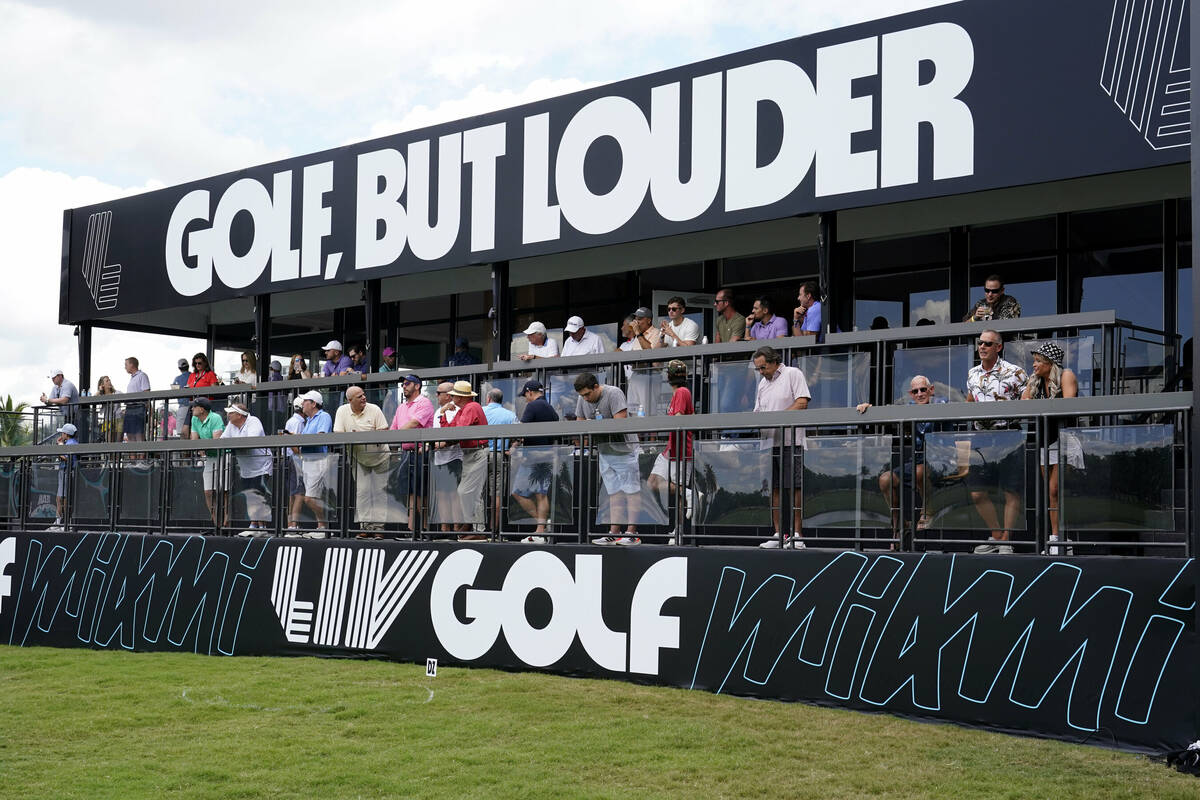 Fans watch on the 18th green on the first day of the LIV Golf Team Championship at the Trump Na ...