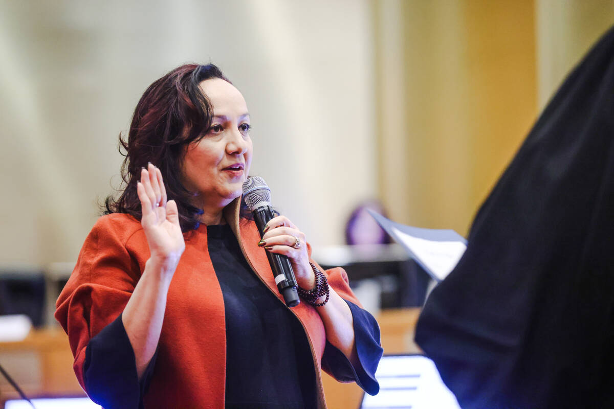 Ramona Esparza-Stoffregan, former principal of Valley High School, is sworn in as a nonvoting m ...