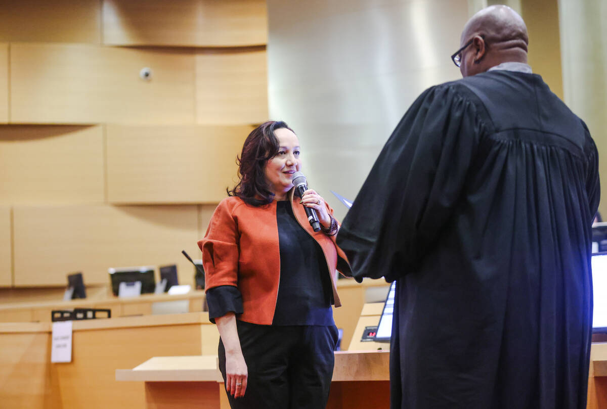 Ramona Esparza-Stoffregan, former principal of Valley High School, is sworn in as a nonvoting m ...