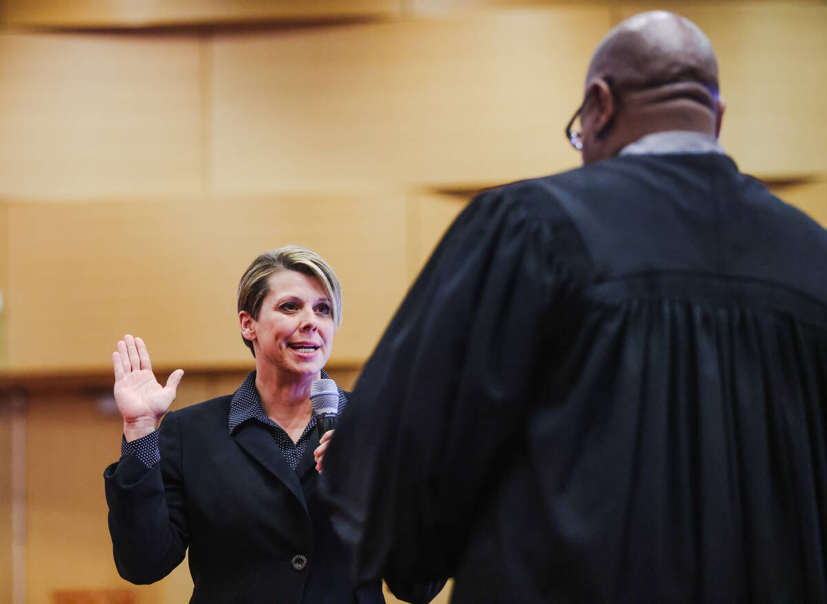 Lisa Satory, a former charter school principal, is sworn in as a nonvoting member of the Clark ...