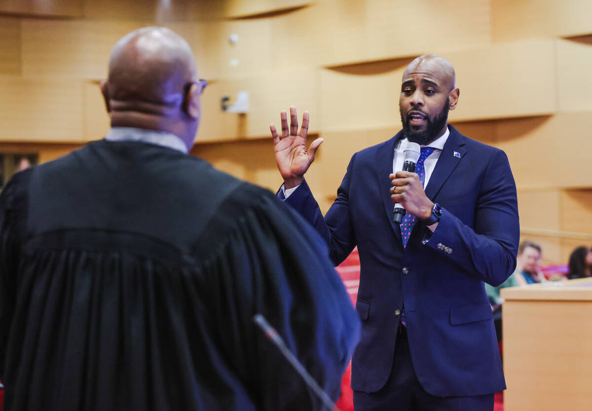 Adam Johnson, a former charter school leader, is sworn in as a nonvoting member of the Clark Co ...