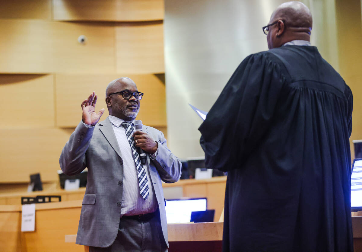 Dane Watson, a teachers union organizer, is sworn in as a nonvoting member of the Clark County ...