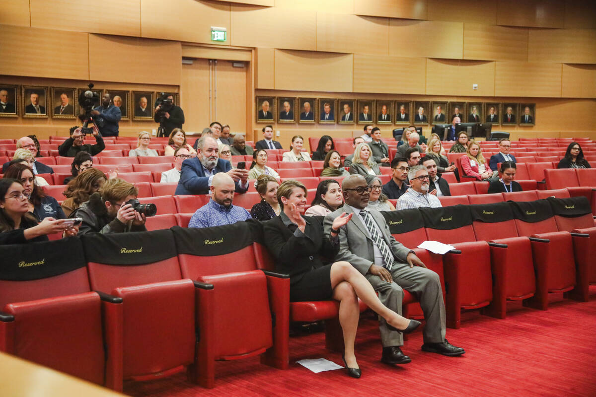 The crowd applauds as nonvoting members of the Clark County School Board are sworn in at City H ...