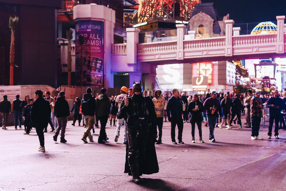 A busker dressed as Batman walks around the Strip on Sunday, Dec. 31, 2023, in Las Vegas. (Made ...