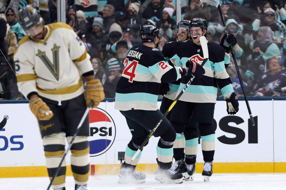 Seattle Kraken defenseman Will Borgen (3) facing celebrates his goal with left wing Tye Kartye ...