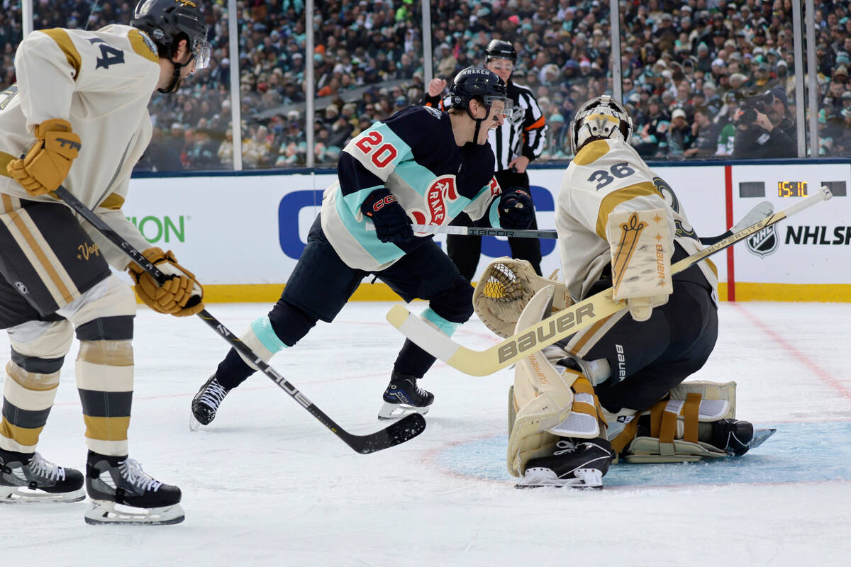 Seattle Kraken right wing Eeli Tolvanen (20) reacts after scoring with Vegas Golden Knights goa ...