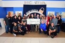 Presenting a check to this year’s recipients of the Valley Automall’s 12 Days of Giving are ...