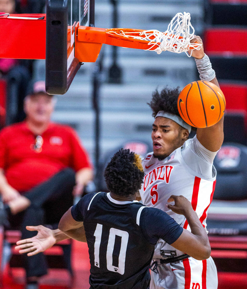 UNLV Rebels forward Rob Whaley Jr. (5) dunks the ball over Bethesda University Flames forward J ...