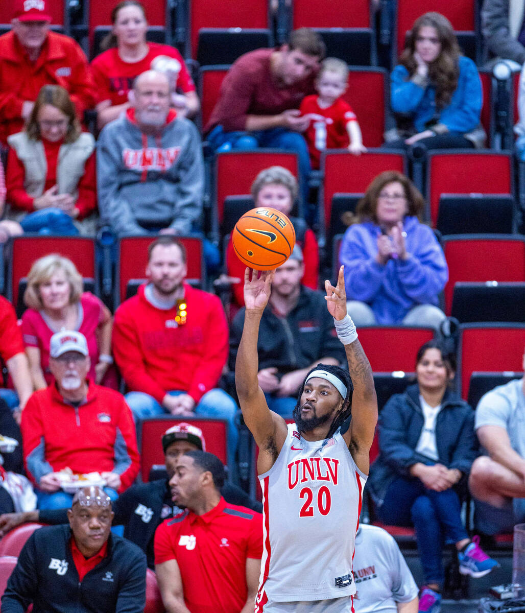 UNLV Rebels forward Keylan Boone (20) posts up for a shot against the Bethesda University Flame ...