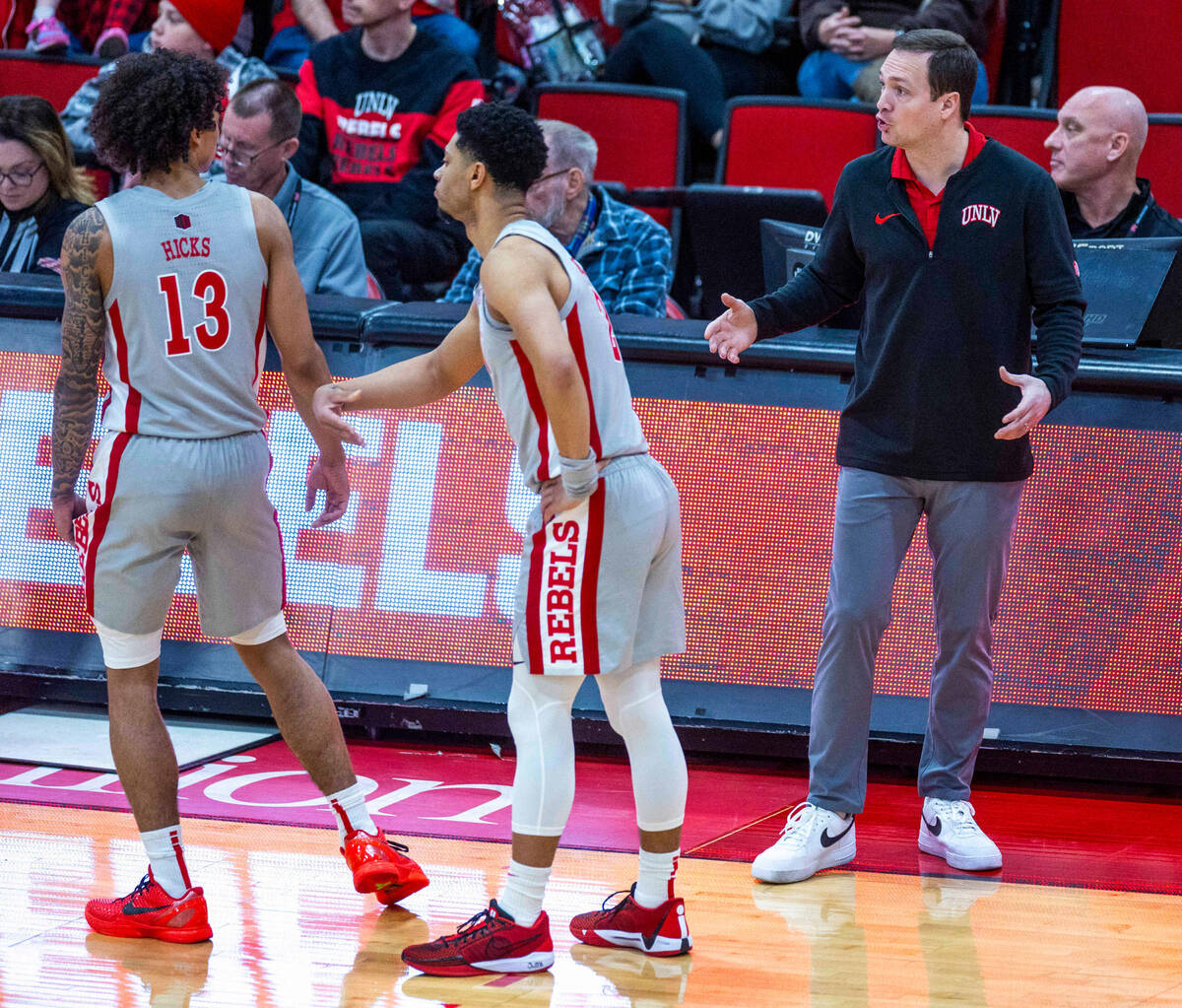 UNLV Rebels head coach Kevin Kruger talks to guard Brooklyn Hicks (13) on foul shots for the B ...