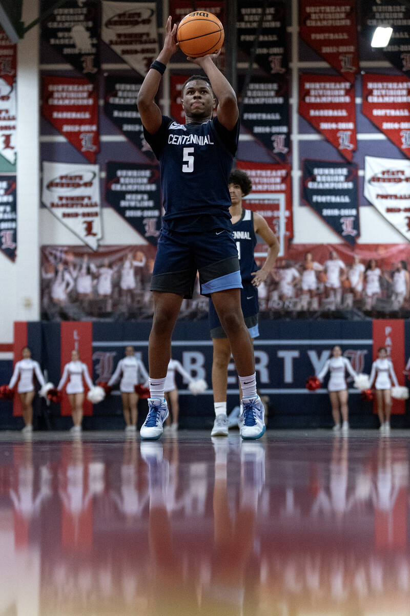 Centennial guard RJ Nance (5) shoots a free throw during the second half of a boys high school ...