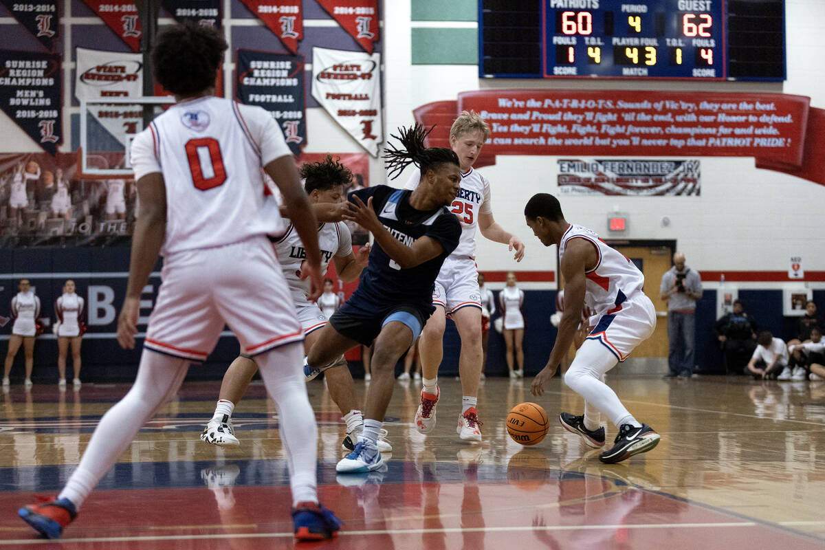 Centennial guard RJ Nance (5) loses control of the ball to Liberty during the second half of a ...