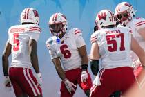 Wisconsin wide receiver Will Pauling (6) celebrates with wide receiver Quincy Burroughs (5) and ...