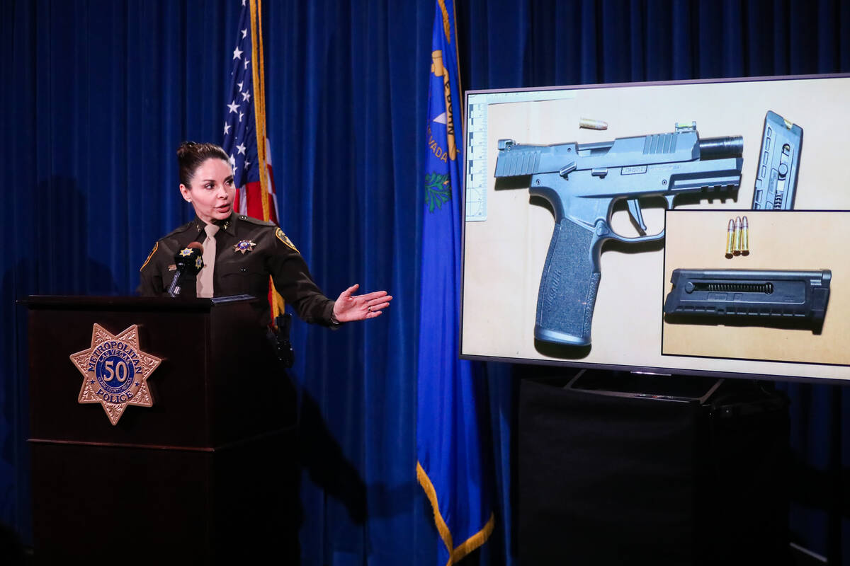 Assistant Sheriff Sasha Larkin motions to an image of a suspect’s weapon that was recove ...