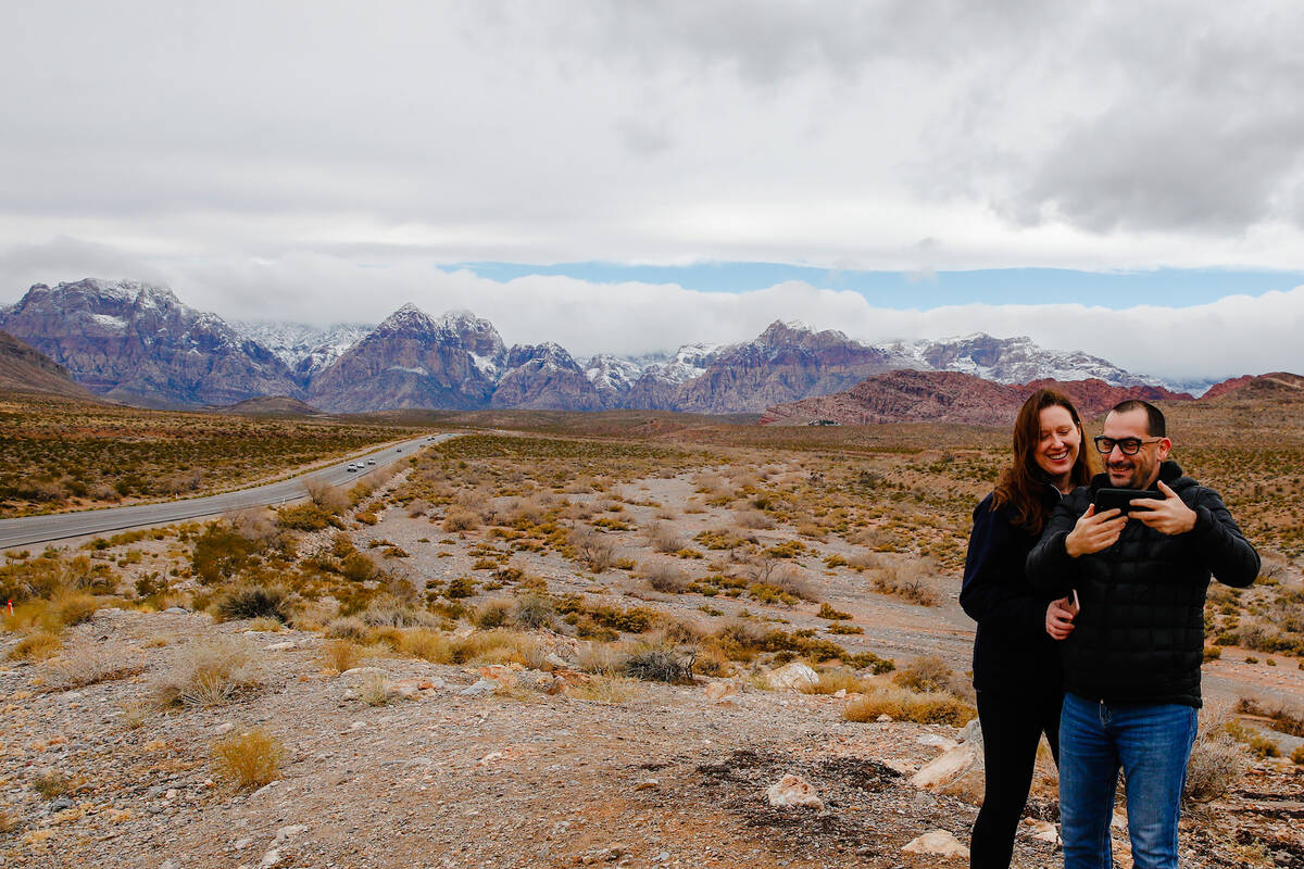 Justin Poma and Melissa Smith, visiting from Toronto, take a selfie in front of Red Rock Canyon ...