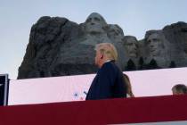 Donald Trump watches as planes perform fly-overs of the Mount Rushmore National Monument. (AP P ...
