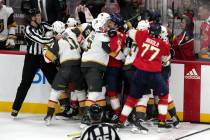 An official tries to control a scuffle between the Florida Panthers and the Vegas Golden Knight ...