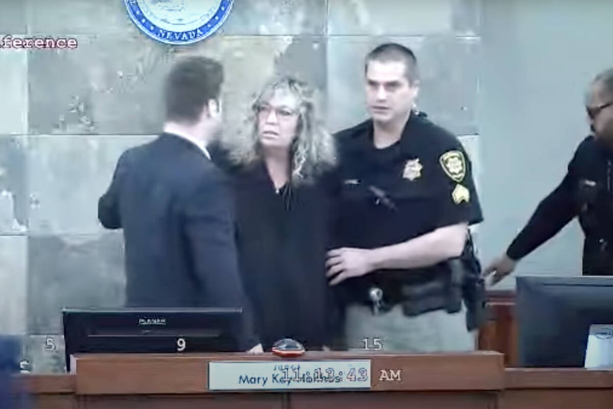 This is a video screen shot of Judge Mary Kay Holthus being aided after she was attacked by def ...
