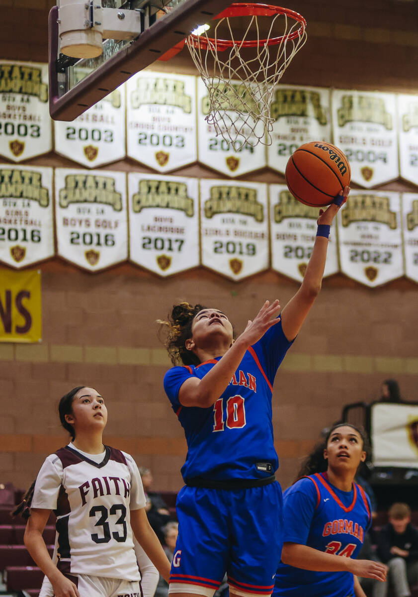 Bishop Gorman point guard Aaliah Spaight (10) goes for a layup during a game at Faith Lutheran ...