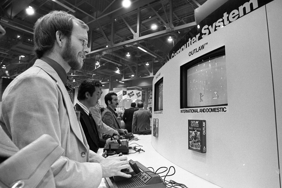Attendees play Atari video games during the 2nd International CES show January 7, 1979, at the ...