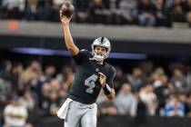 Raiders quarterback Aidan O'Connell (4) throws during the first half of an NFL game against the ...
