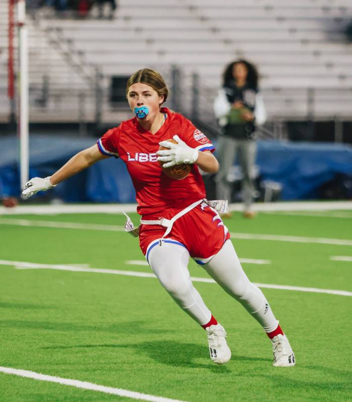 Liberty flag football wide receiver Brinlee Yurek carries the ball during a game against Shadow ...