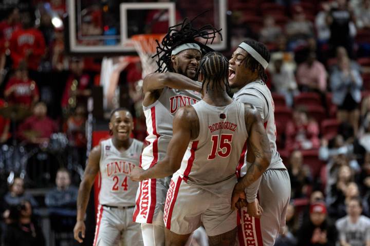 UNLV Rebels forward Keylan Boone, left, guard Luis Rodriguez (15) and forward Rob Whaley Jr., r ...