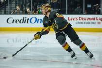 Golden Knights center Jack Eichel (9) shuffles the puck down the ice during a game against the ...