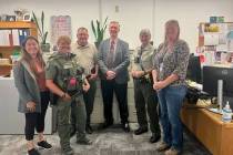 Esmeralda County Sheriff Nicholas Dondero, third from left, poses with members of the staff of ...