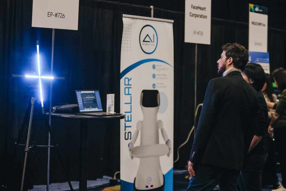 People watch a display by AI Robotics during CES Unveiled at the Mandalay Bay Convention Center ...