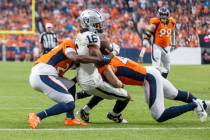Raiders wide receiver Jakobi Meyers (16) makes a catch that resulted in a touchdown with Denver ...