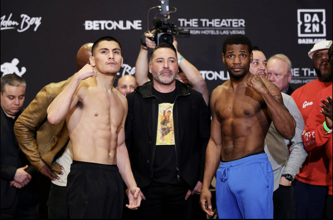 Vergil Ortiz Jr., left, and Fredrick Lawson pose with Golden Boy Promotions chairman Oscar De L ...