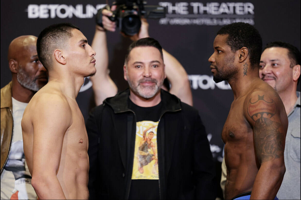 Vergil Ortiz Jr., left, and Fredrick Lawson pose with Golden Boy Promotions chairman Oscar De L ...