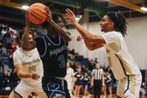 Desert Pines forward Damonte Duhart (3) passes the ball during a game at Spring Valley High Sch ...