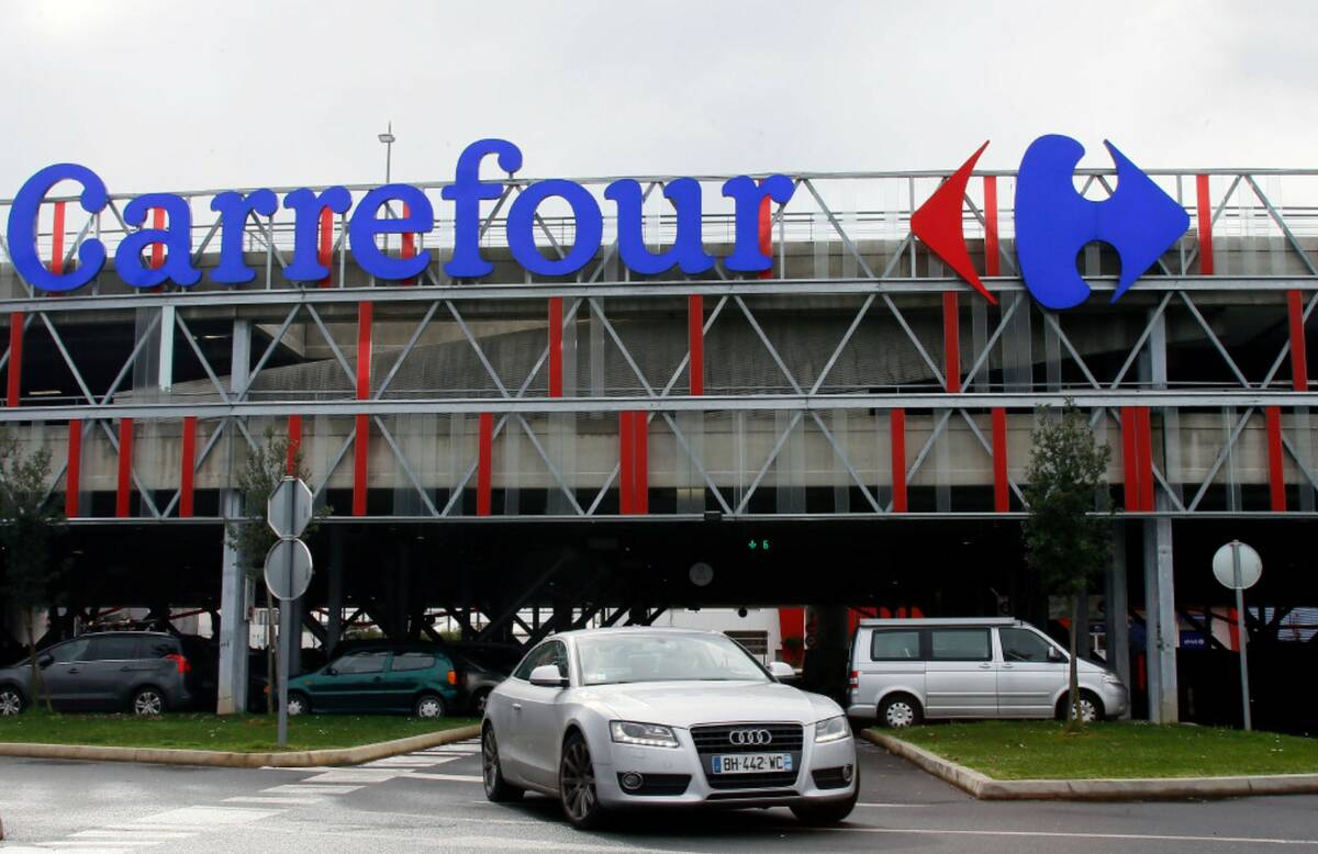 A car leaves a Carrefour supermarket in Anglet, southwestern France, on Jan.23, 2018. (AP Photo ...