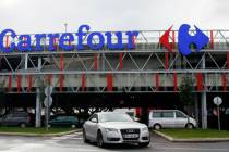 A car leaves a Carrefour supermarket in Anglet, southwestern France, on Jan.23, 2018. (AP Photo ...