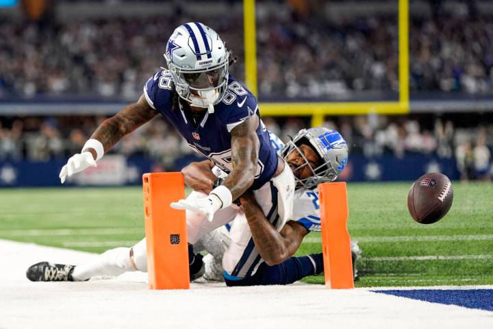 Dallas Cowboys wide receiver CeeDee Lamb (88) fumbles the ball as Detroit Lions cornerback Kind ...