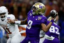 Washington quarterback Michael Penix Jr. throws a pass during the first half of an NCAA college ...