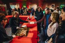 King cake is passed out during a Clark County celebration for Three Kings Day at the Clark Coun ...