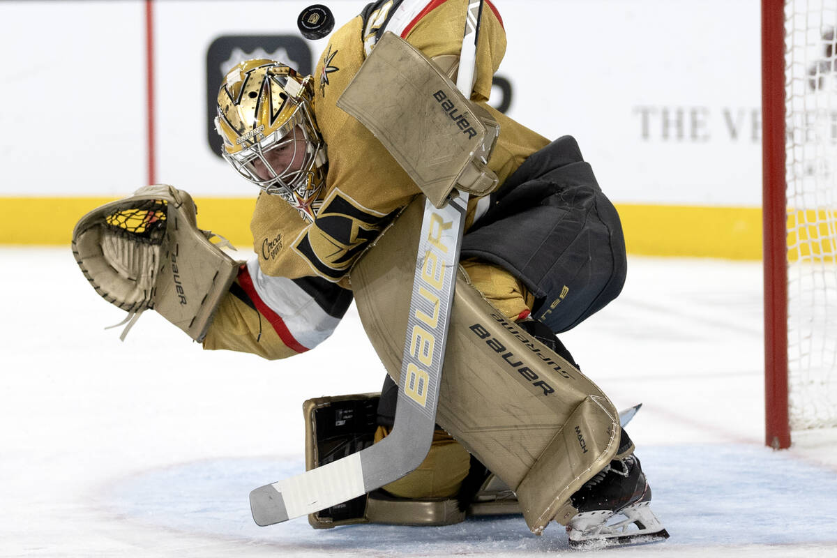 Golden Knights goaltender Logan Thompson (36) saves the puck during the second period of an NHL ...