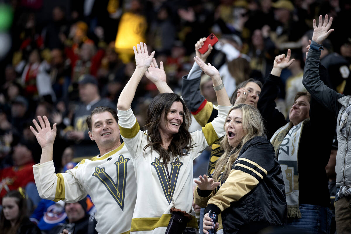 Golden Knights fans dance to the music during the third period of an NHL hockey game Islanders ...