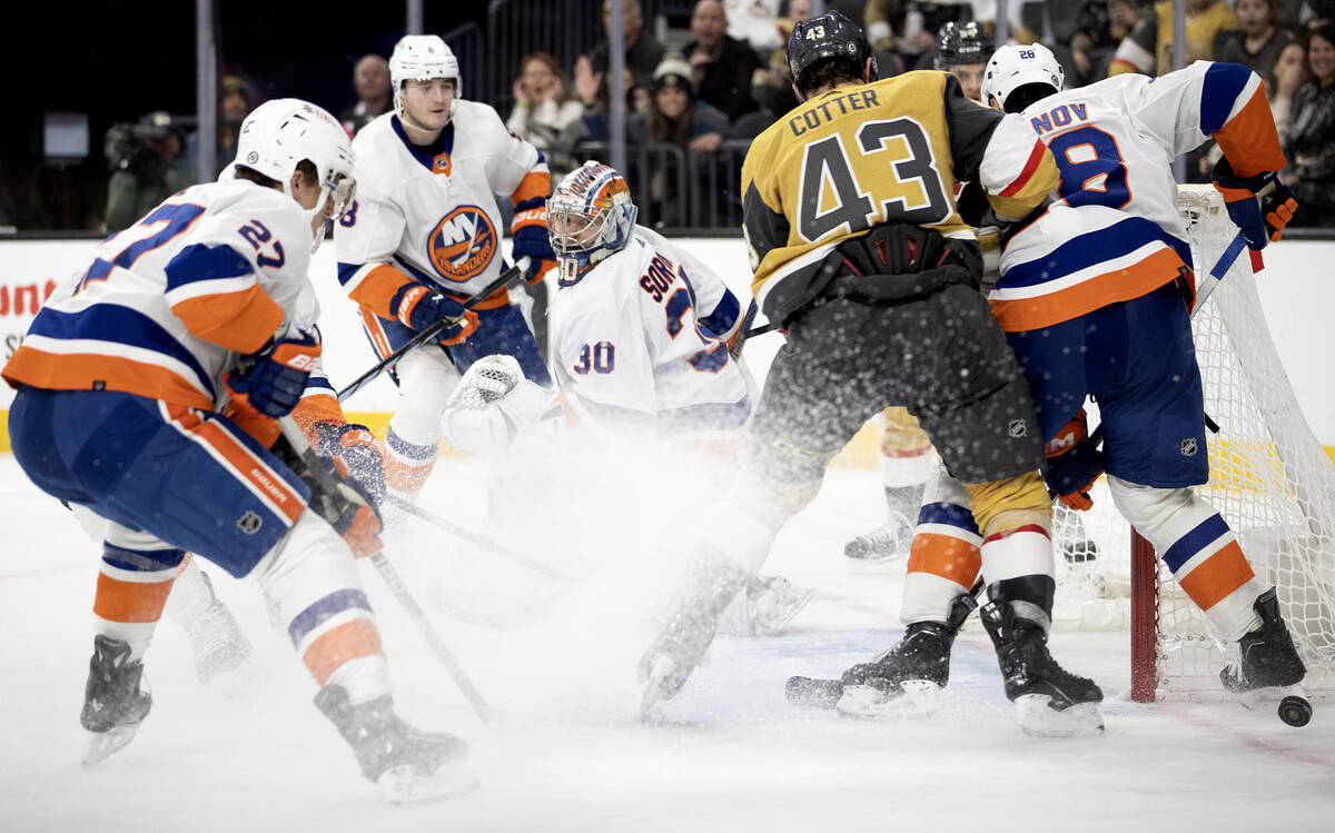 Islanders goaltender Ilya Sorokin (30) looks for the puck while Golden Knights goaltender Jiri ...