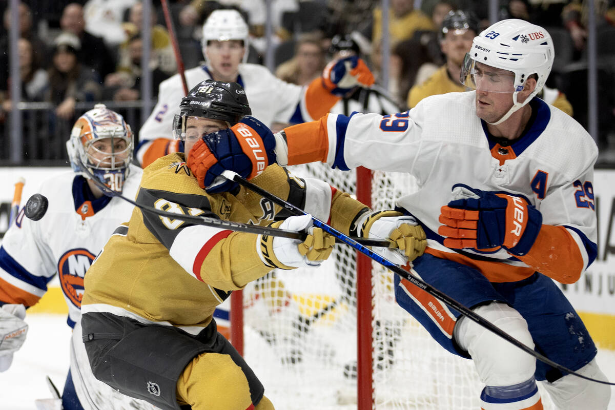 Golden Knights right wing Jonathan Marchessault (81) and Islanders center Brock Nelson (29) cro ...