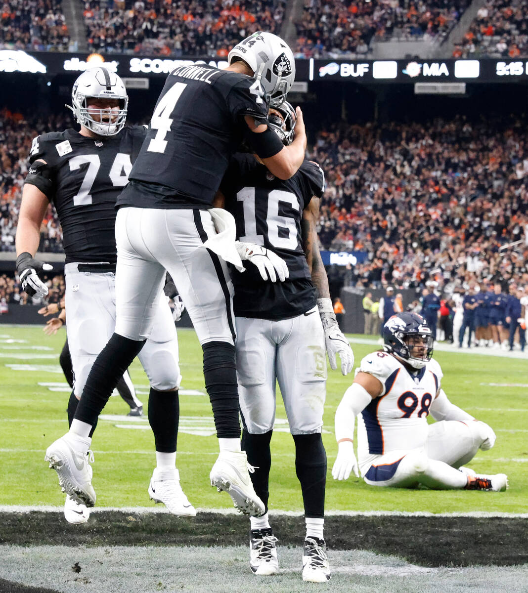 Raiders wide receiver Jakobi Meyers (16) celebrates his touchdown with quarterback Aidan O'Conn ...