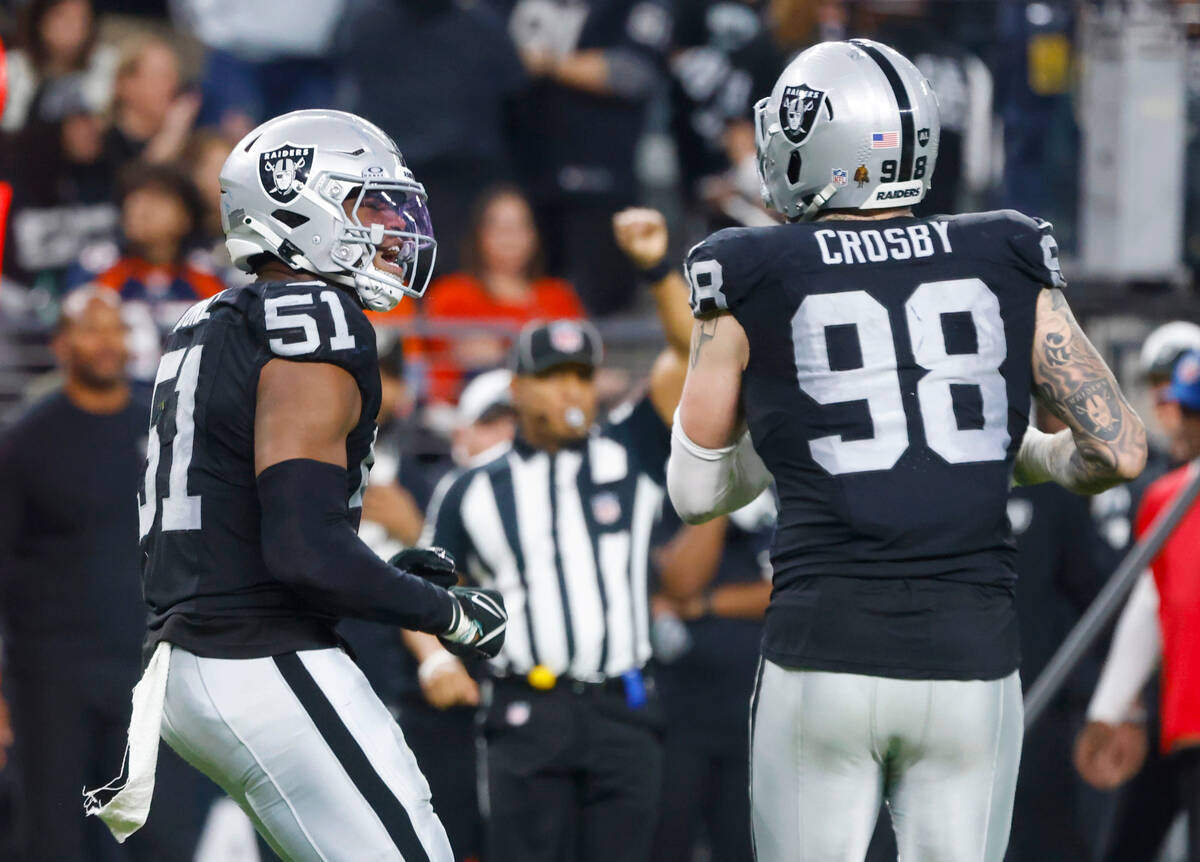 Raiders defensive end Malcolm Koonce (51) reacts after sacking Denver Broncos quarterback Jarre ...