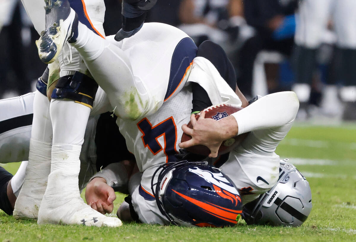 Raiders defensive end Malcolm Koonce (51) sacks Denver Broncos quarterback Jarrett Stidham (4) ...