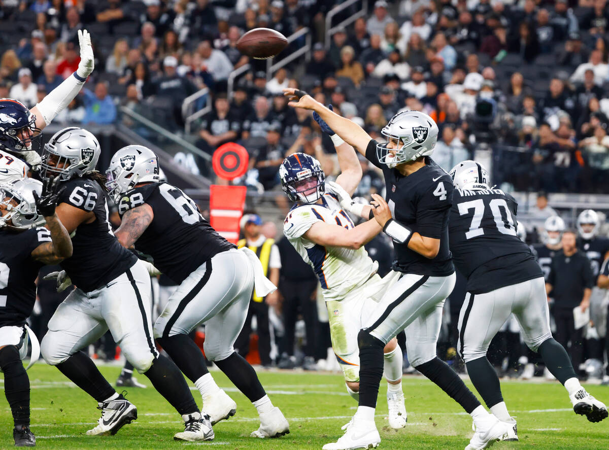 Raiders quarterback Aidan O'Connell (4) throws a pass against the Denver Broncos during the sec ...