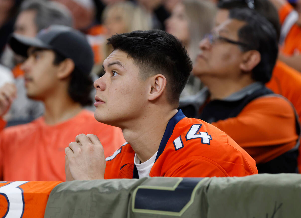 Denver Broncos fans watch as their team loses to Raiders during the second half of an NFL footb ...