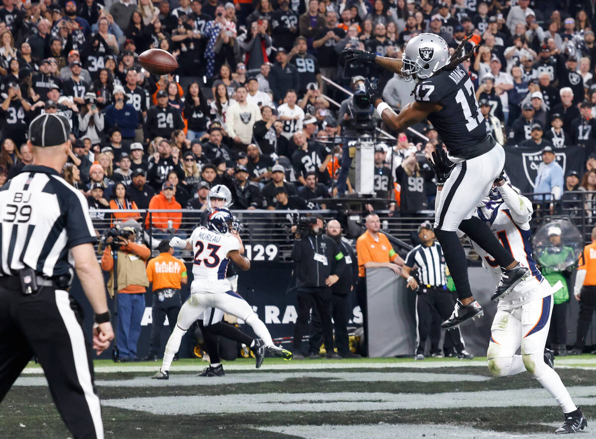Raiders wide receiver Davante Adams (17) jumps high but unable to catch a pass as Denver Bronco ...